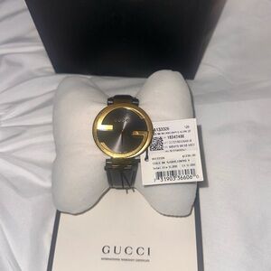 Gucci Women's Luxurious Black and Gold Watch